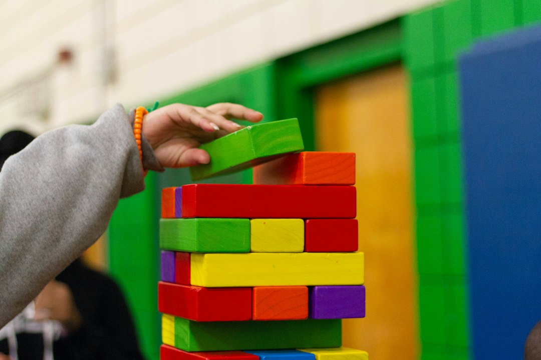 Therapist and child in warm developmental therapy space