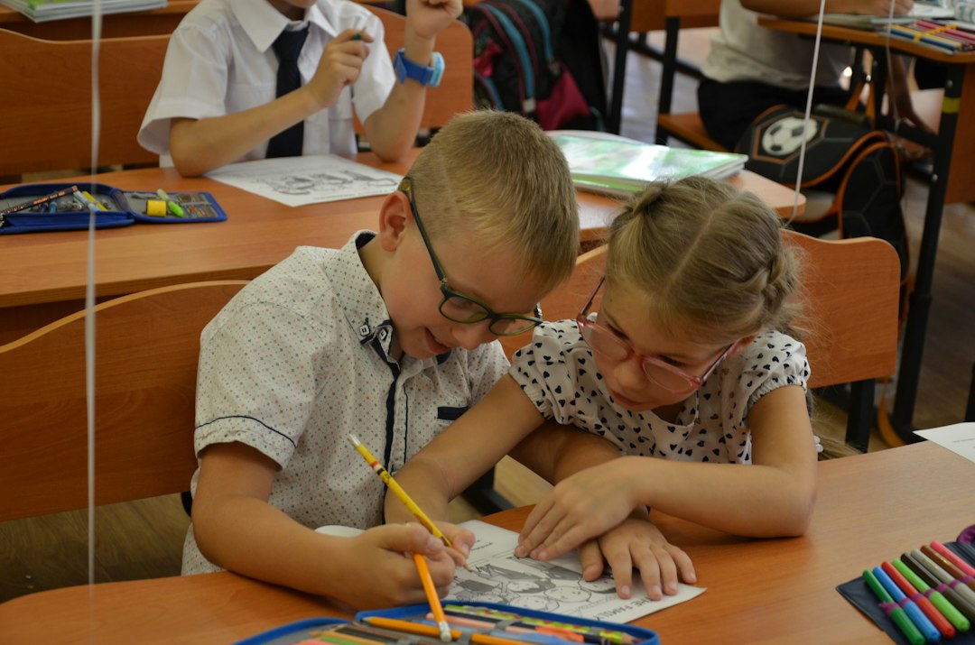 Children collaborating on educational desk activity