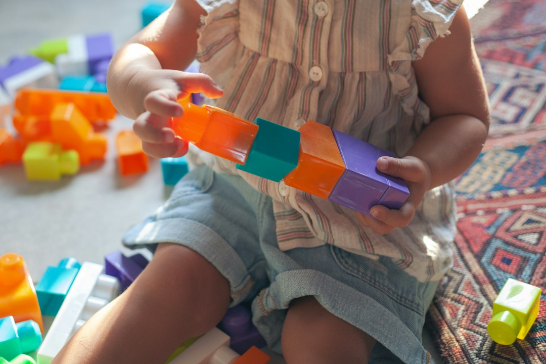 Supervised child engaged in fine motor activity